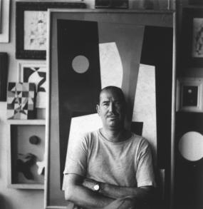 Charles G. Shaw with his painting “Abstract Composition-8” (1943)