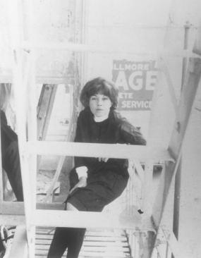 Jay DeFeo on the fire escape of her flat at 2322 Fillmore Street, San Francisco, CA, 1965