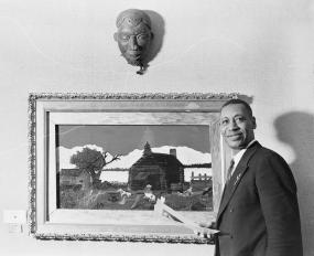 Horace Pippin with his work “Cabin in the Cotton” (c.1931-1937), c.1945