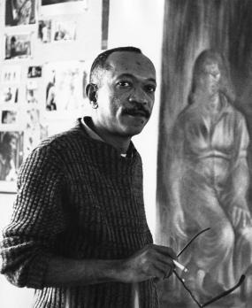 Charles White in his studio with “Let The Light Enter” (c.1961)
